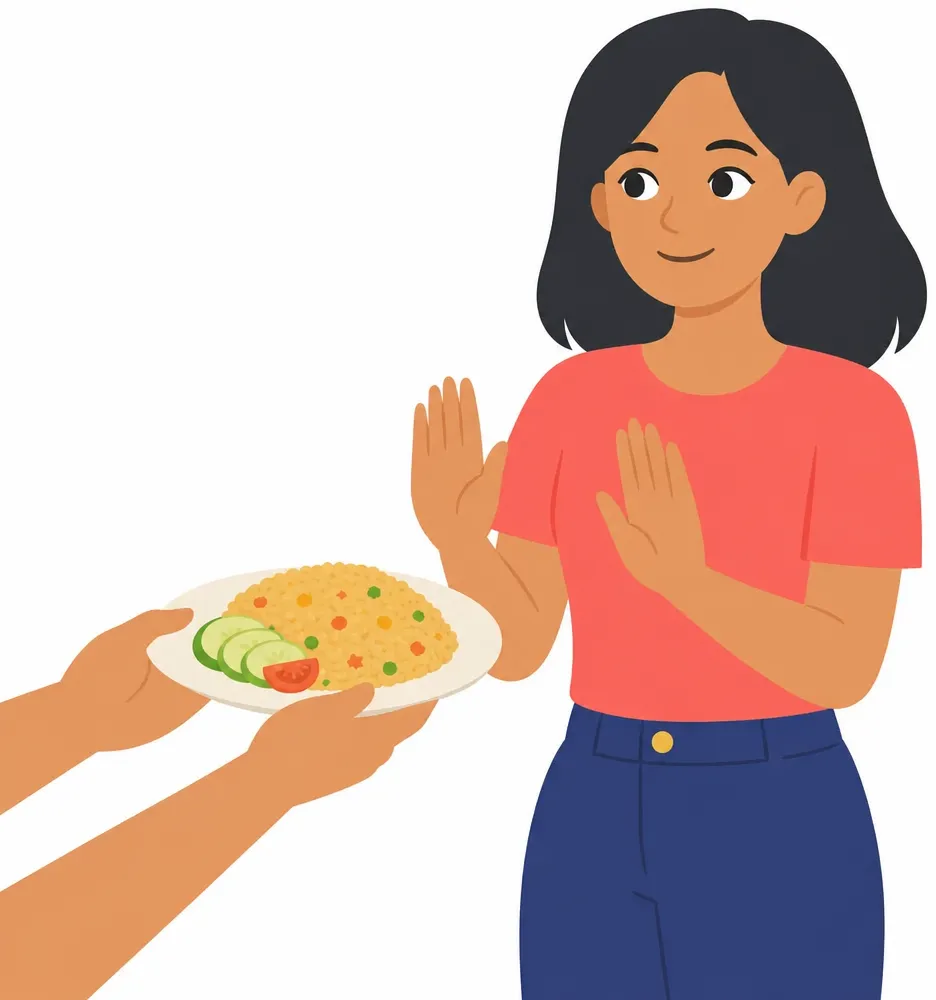 Rina smiles apologetically and raises both palms in a gentle refusal, while a hand off-frame offers her a plate.